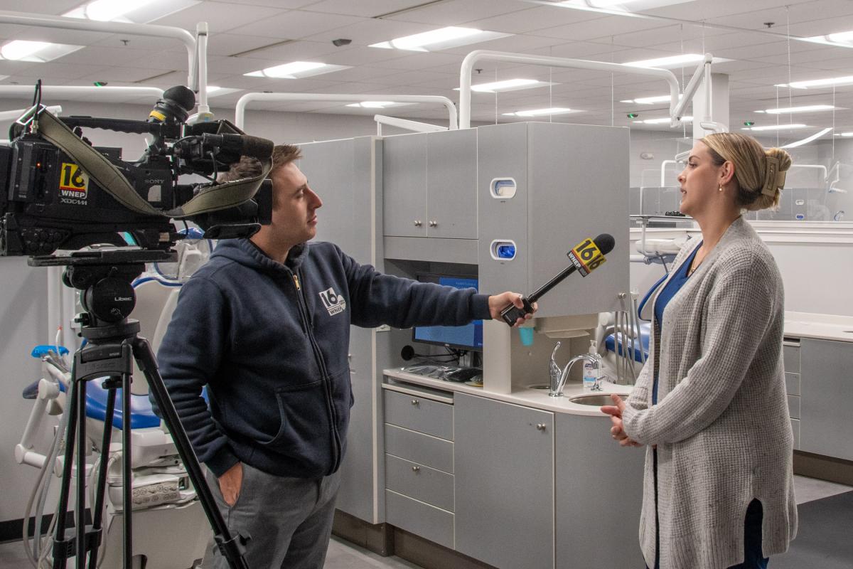 Tiana L. Minnick, instructor of dental hygiene, talks with Keating about the college’s upcoming Sealant Saturday event.