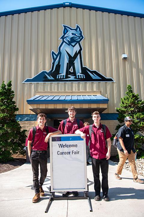 Fair weather! Prompted by a photographer, automotive technology students stand ready for action (from left): Eyan M. Oliveira, Lucas D’Amato and Griffin J. Romania.