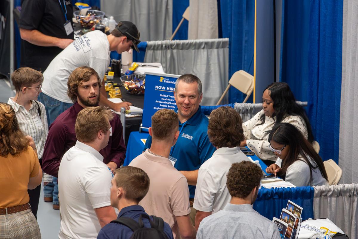 Stahl Sheaffer Engineering’s Paul McClellan is encircled by eager students. 