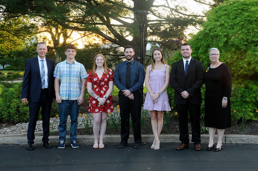 Five recipients of this semester's collegewide graduation awards gather with retiring Pennsylvania College of Technology President Davie Jane Gilmour and Michael J. Reed, who will assume the presidency on July 1. The students (from left) are Jesse James Walker, Lewis H. Bardo Memorial Award; Caila Nicole Flanagan, President's Award; Wesley Scott McCray, Lewis H. Bardo Memorial Award; Callie Alexandra Sobolewski, Rose Staiman Memorial Award; and Aaron Dylan McGarvey, Board of Directors' Award.