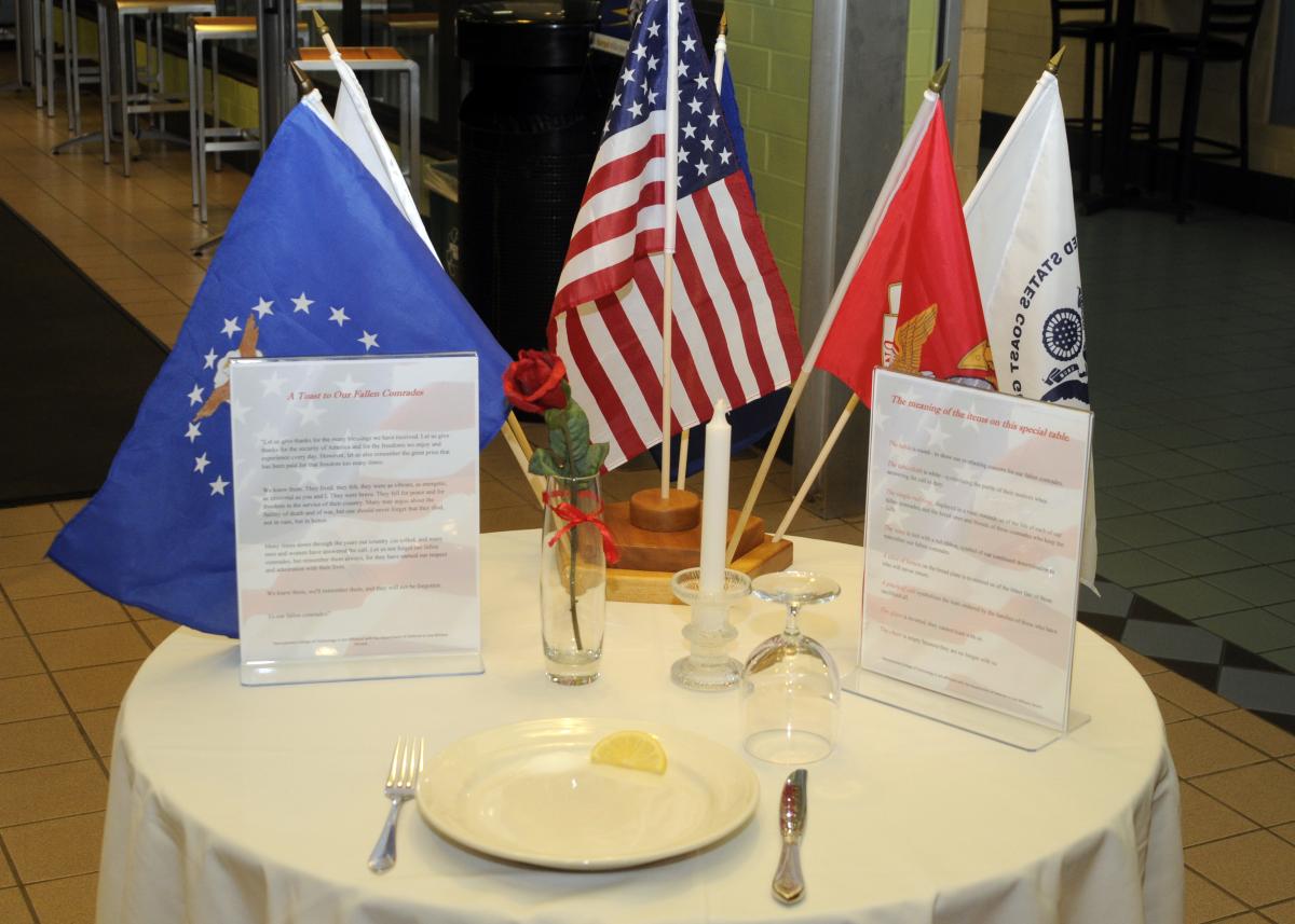 Empty tables across campus, symbolically set and reverently intended, remember those who didn't come home.