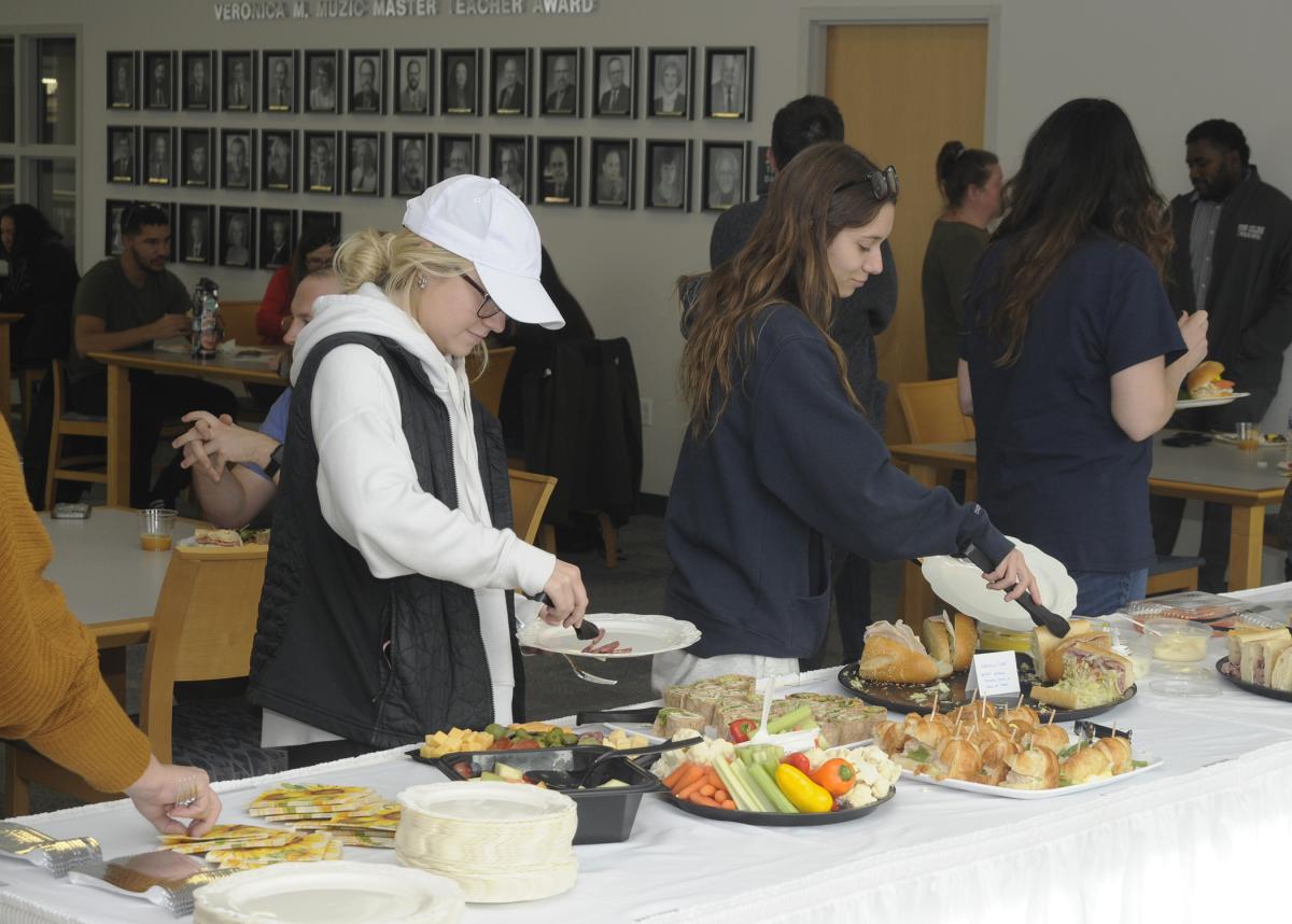 First-generation students move through the lunch line Wednesday on the second floor of The Madigan Library ... 