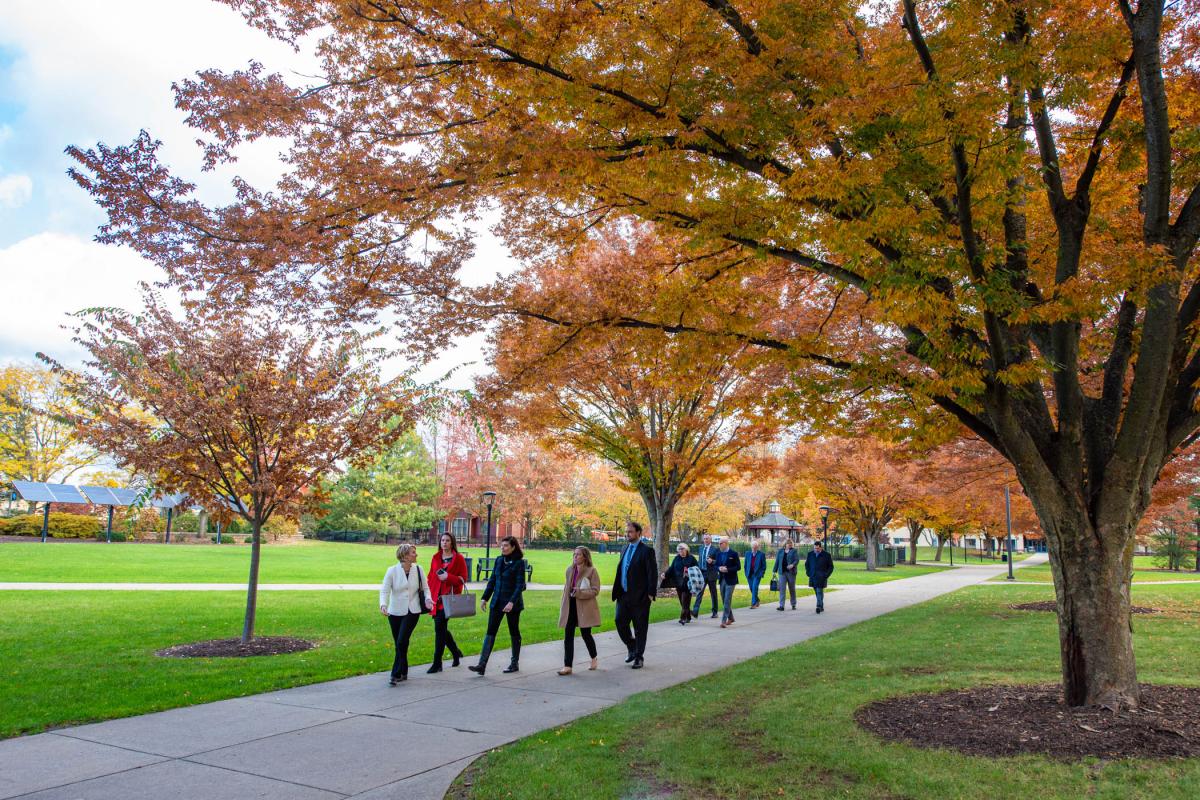 On a beautifully brisk Nov. 1, Kline leads the way down the campus mall.