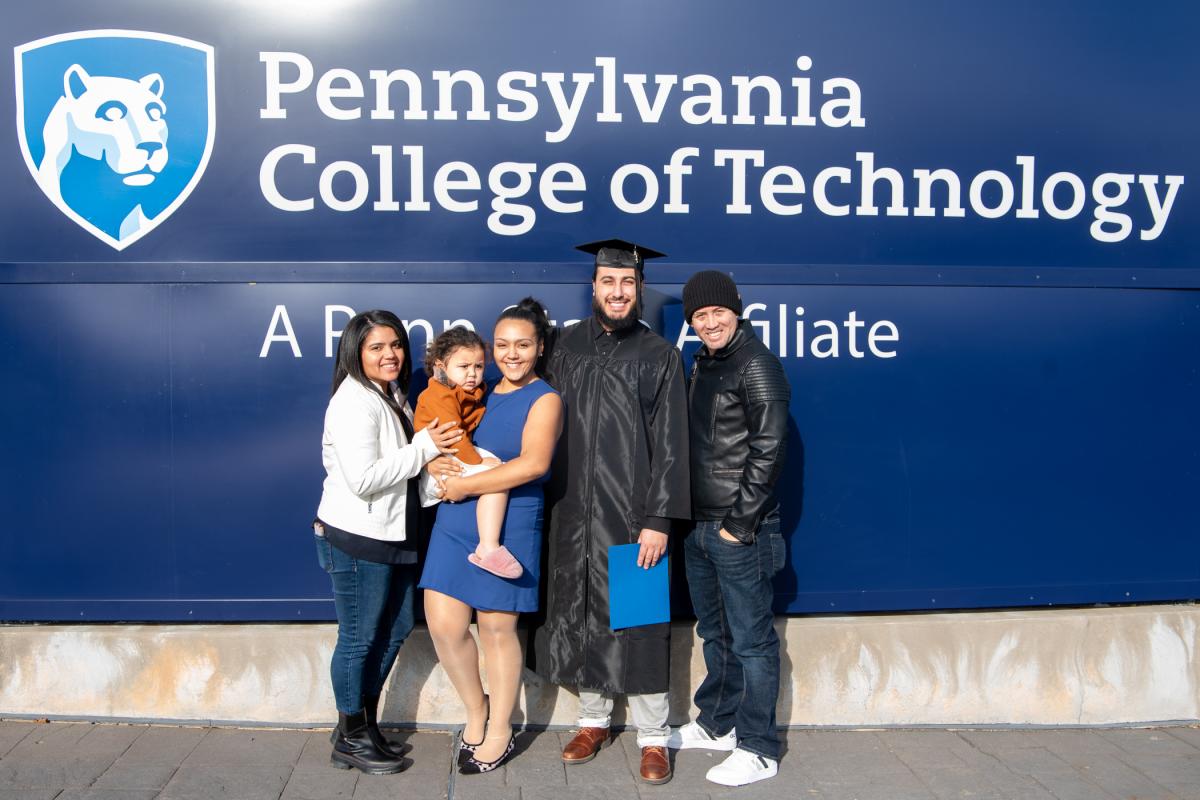 Victor Angelo Mumtaz celebrates the day with his loved ones, including Ashlee C. Felix (in blue dress), assistant director of student engagement.