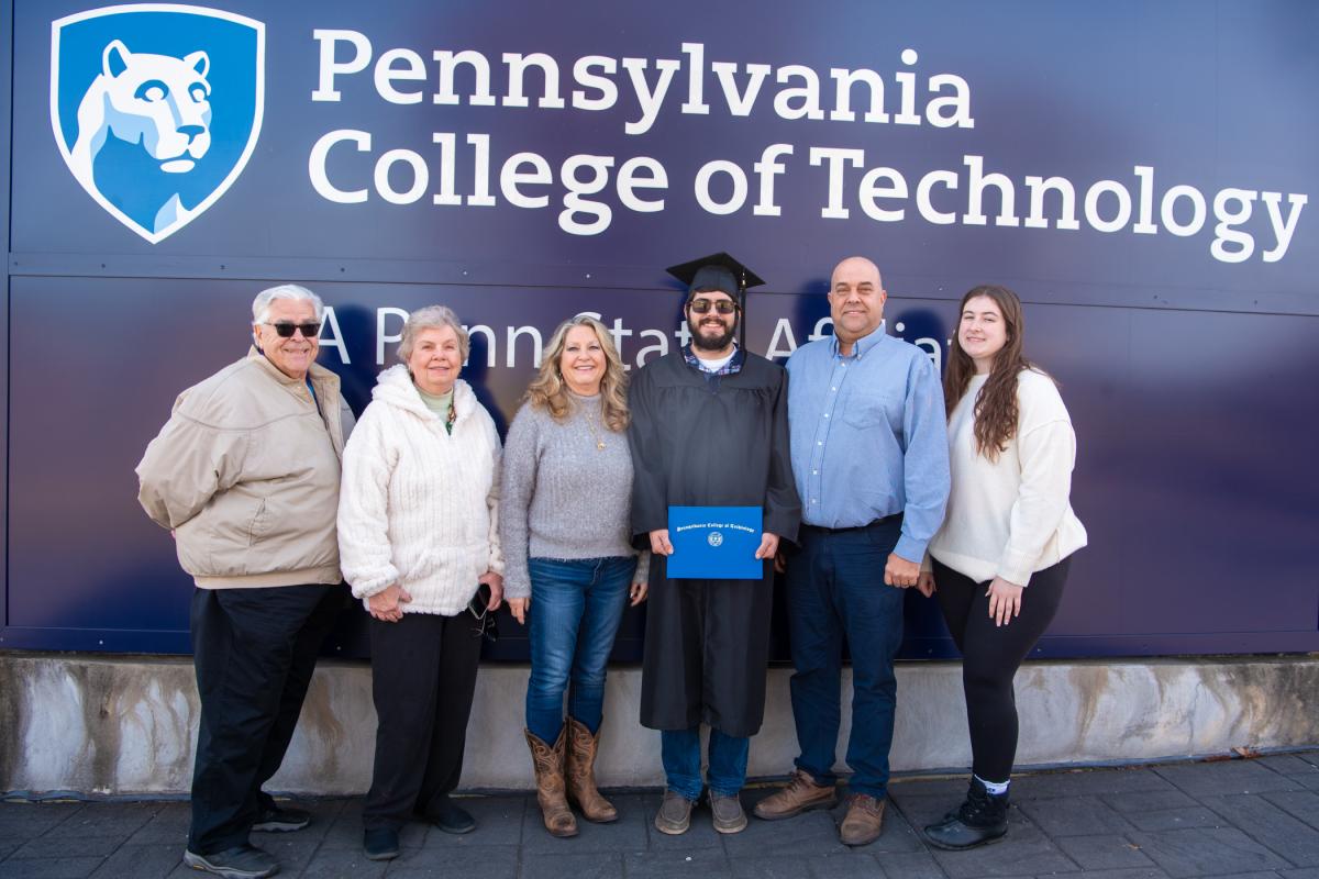 Patrick J. Moran enjoys a post-ceremony photo op with his parents, grandparents and girlfriend. Moran earned a degree in welding & fabrication engineering technology. 