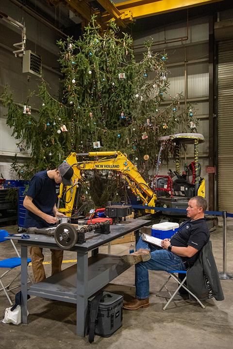 From a picturesque treeside vantage, Dustin Schmerge, fleet maintenance manager at FedEx Freight, judges the Precision Measuring of Engine Components competition.