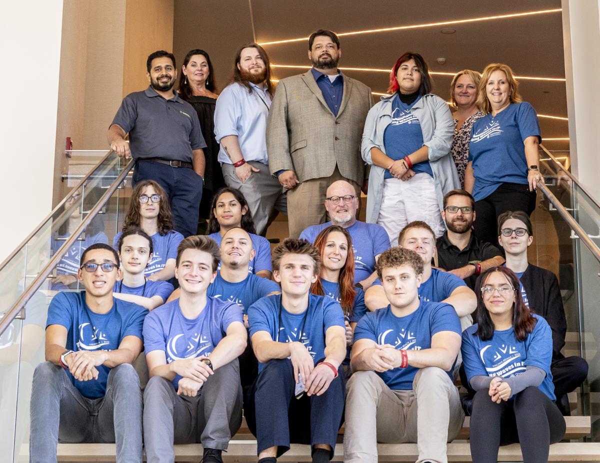Crossen and his students add to a group photo with conference dignitaries and attendees from Gateway Technical School.