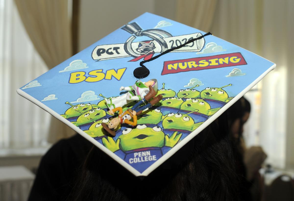 Buzz Lightyear, Woody and friends adorn the mortarboard of Kathleen A. Ross, who earned a bachelor's in nursing and who – quite fittingly – will begin the Disney College Program in April.