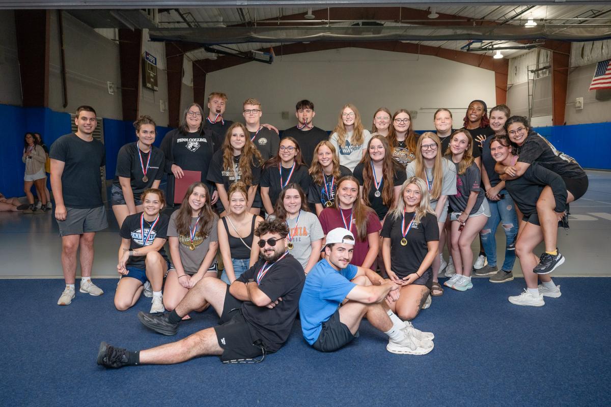 A large group of students, wearing medals around their necks
