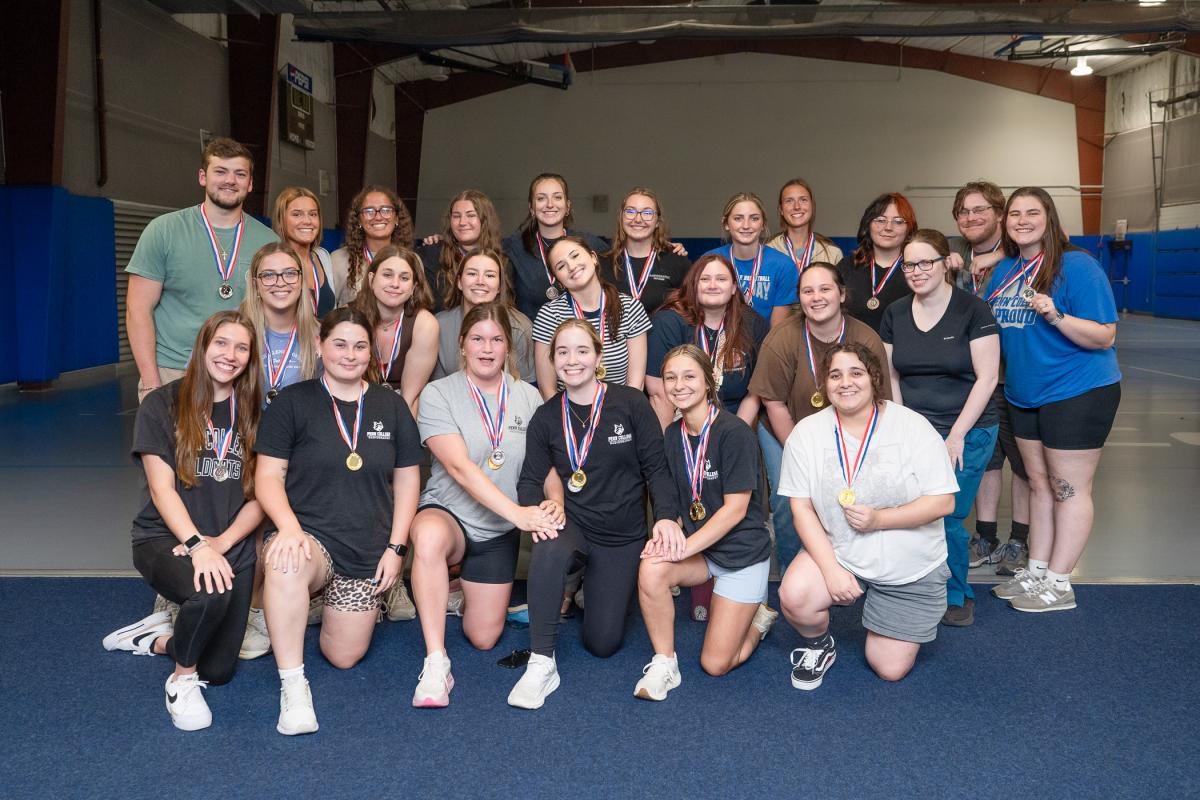 A large group of students, wearing medals around their necks