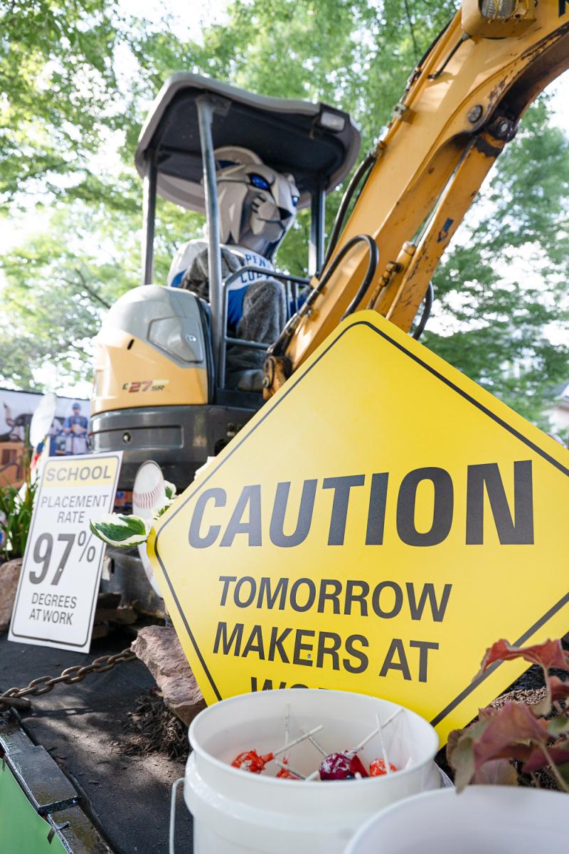 Signs made to mimic road construction signs tout Penn College's 97-plus percent placement rate and its Tomorrow Makers phrasing.