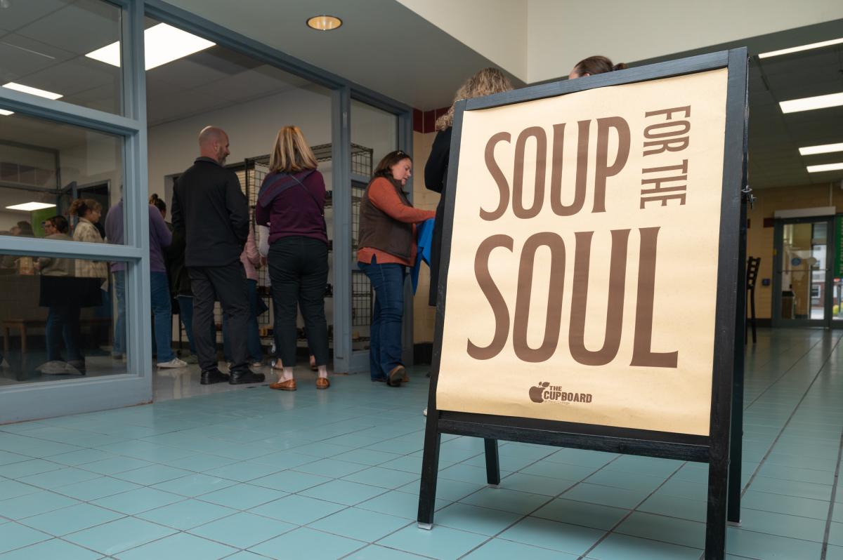 A sign in a Campus Center hallway points to the "Soup for the Soul" event