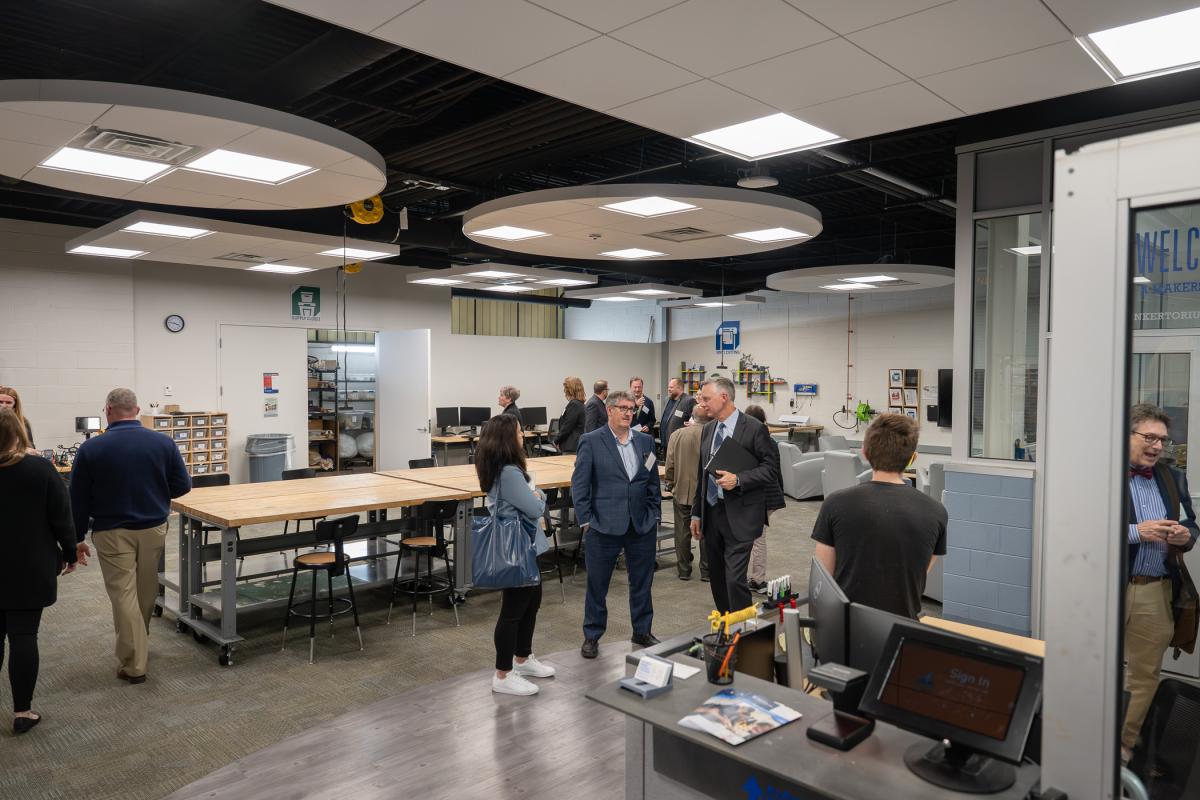 People mingle inside the Dr. Welch Workshop: A Makerspace at Penn College.