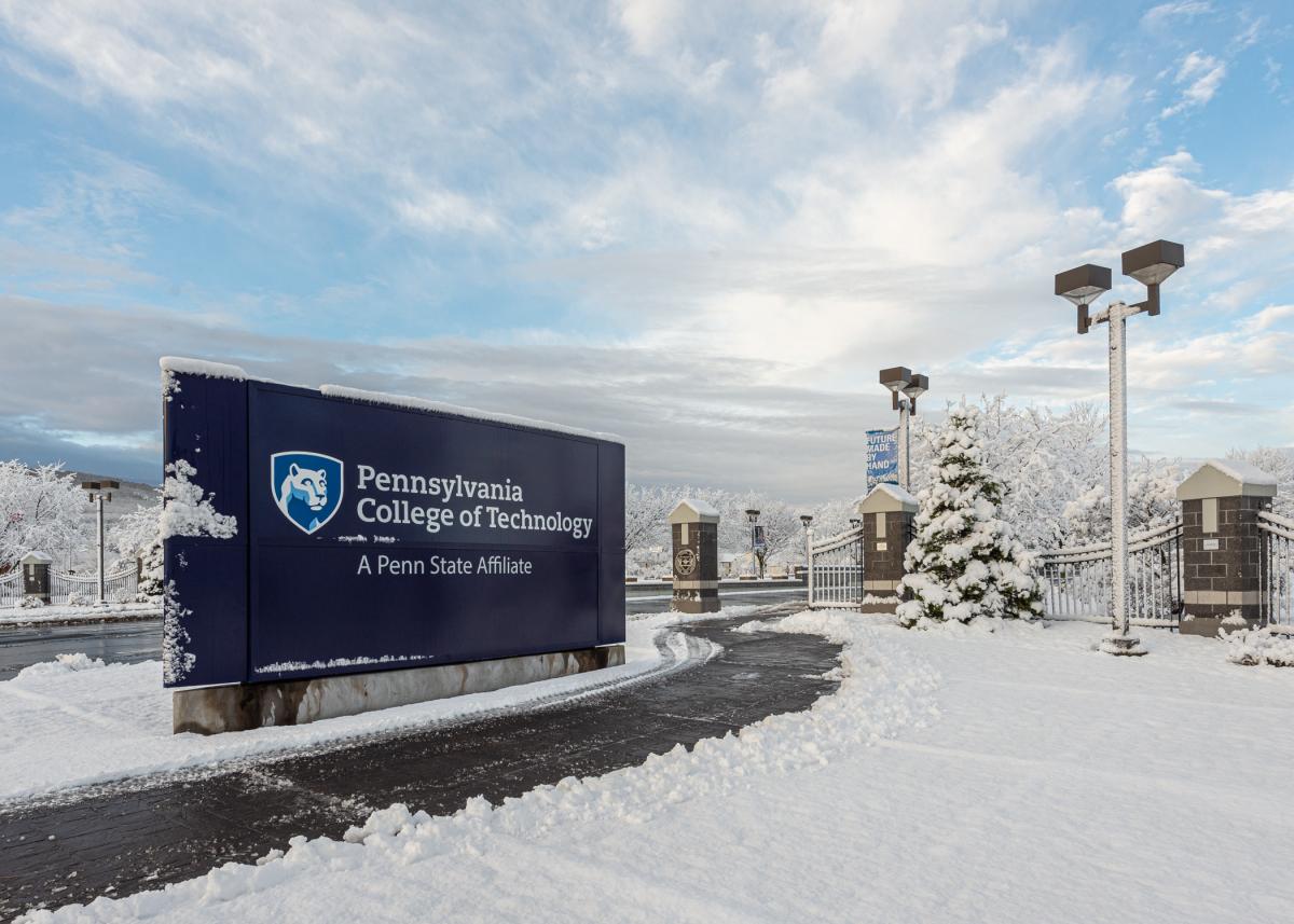 Snow-covered landscape at the Pennsylvania College of Technology main entrance.