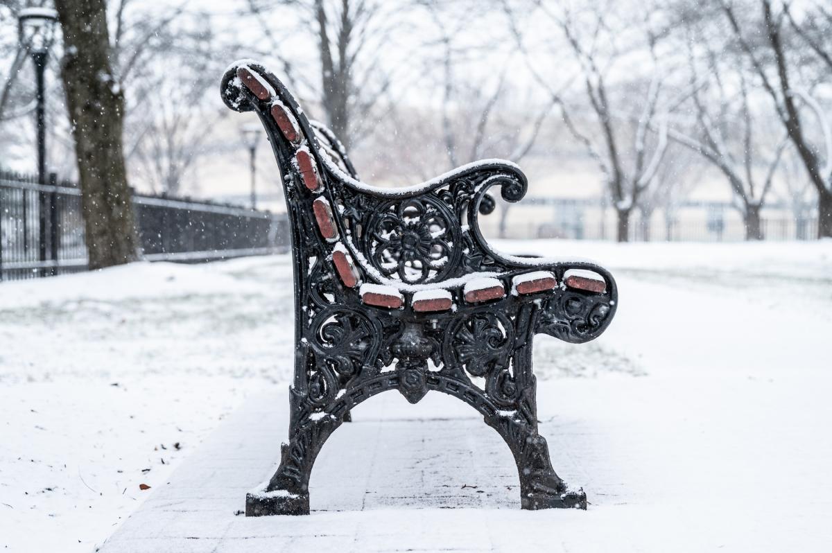 A bench is covered with snow on Penn College's main campus.