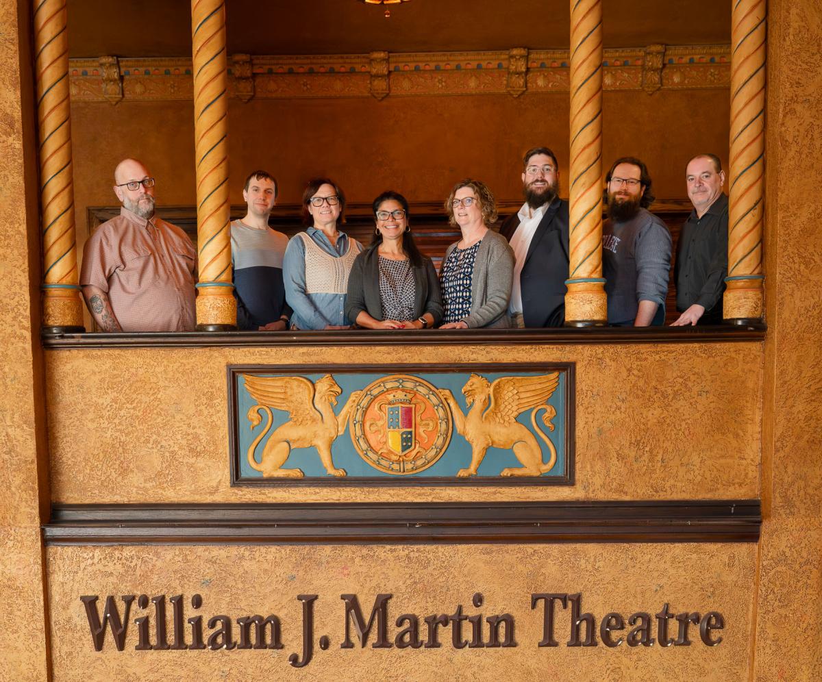 Journey Bank Community Arts Center staff stand in the facility's mezzanine.
