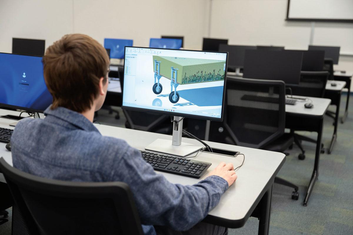 Thomas J. Bodei Jr. works on an assignment in a Penn College engineering design lab. He completed a summer internship with CHL Systems Inc.