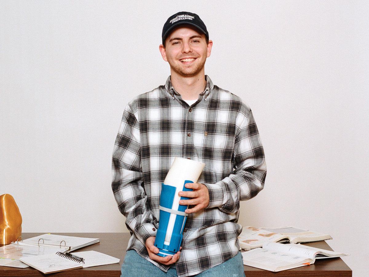 Zachary C. Moore holds a prototype for the “Rose Socket” he designed as a senior project to provide more comfort for those using prosthetic limbs. The 2024 graduate recently received a patent for the invention.