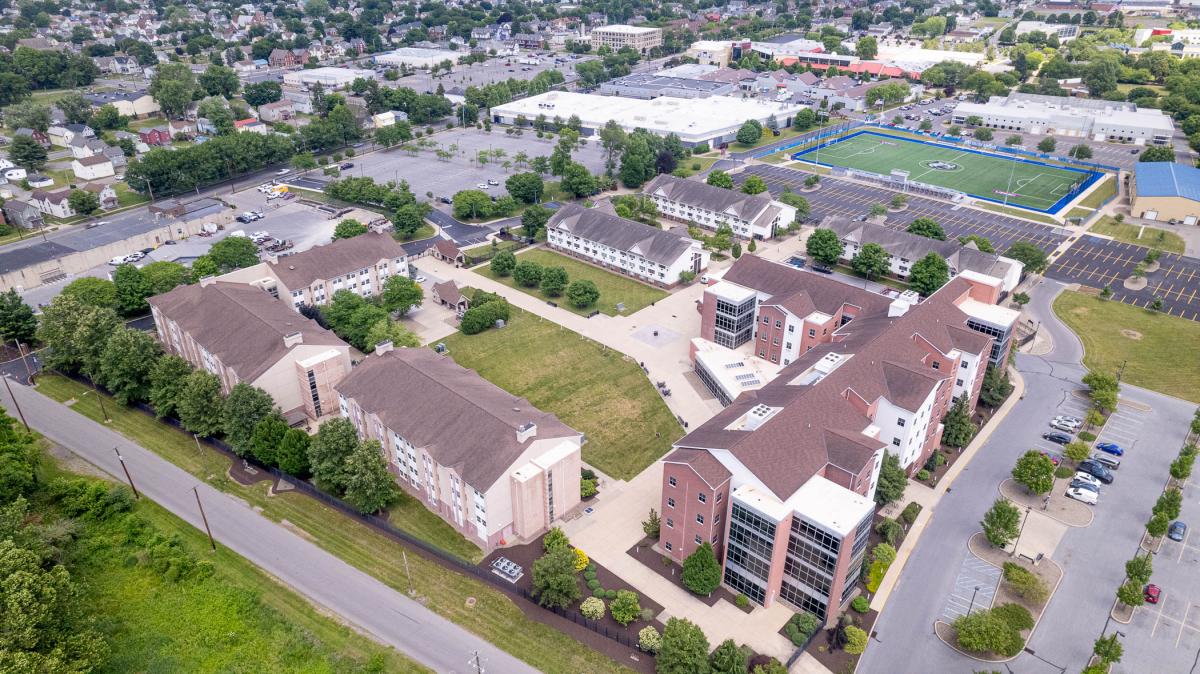 Aerial view of Rose Street Commons student housing with UPMC Field and the the west end of Main Campus in the background