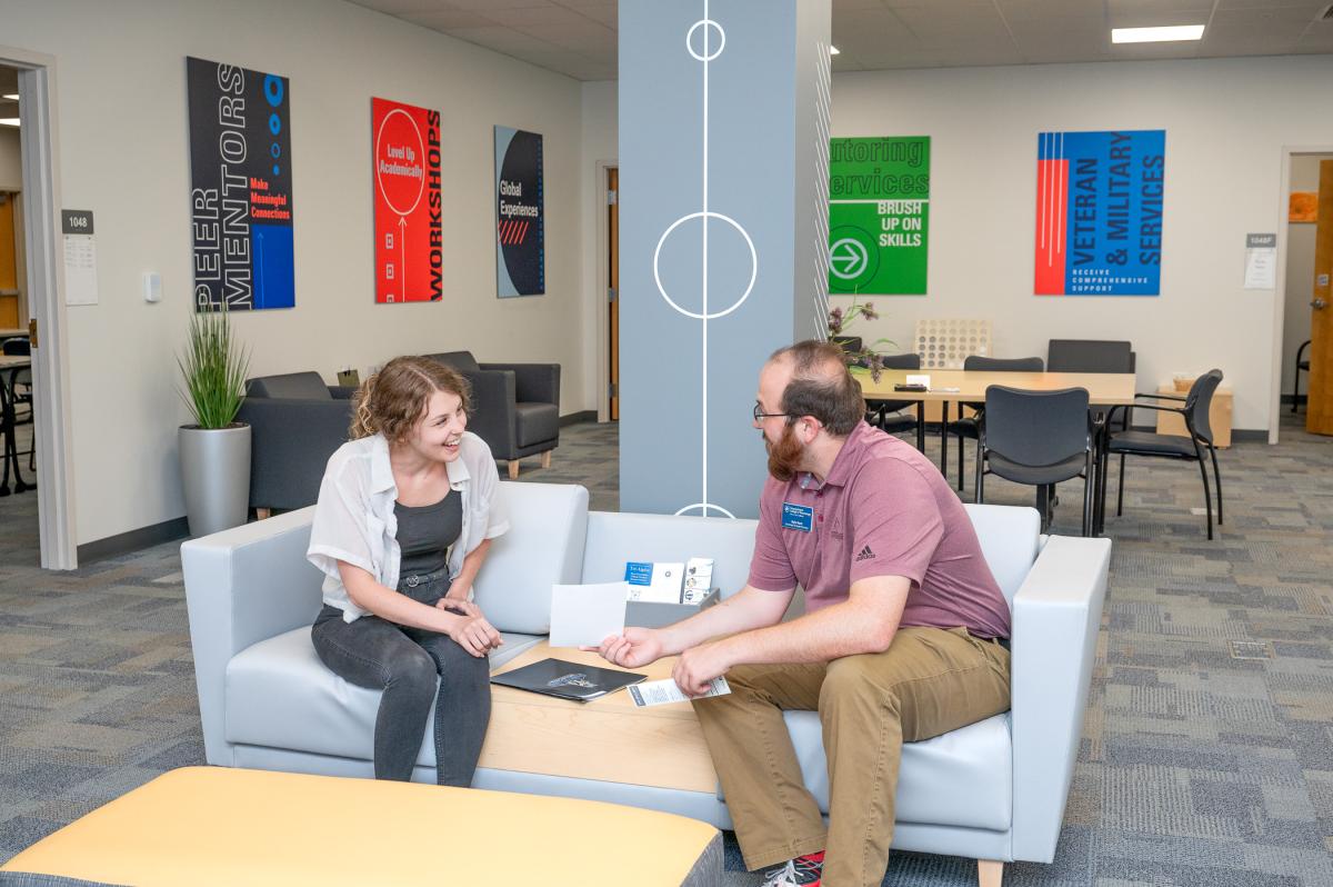 Advisor in Hudock Center meeting with a student.