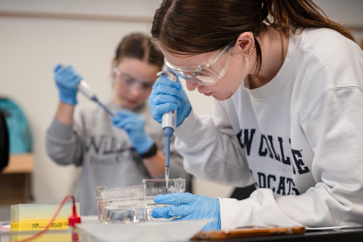 A Biomedical Sciences student practicing pipette skills