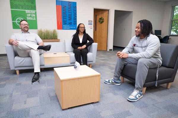 A group of students meeting on couches.
