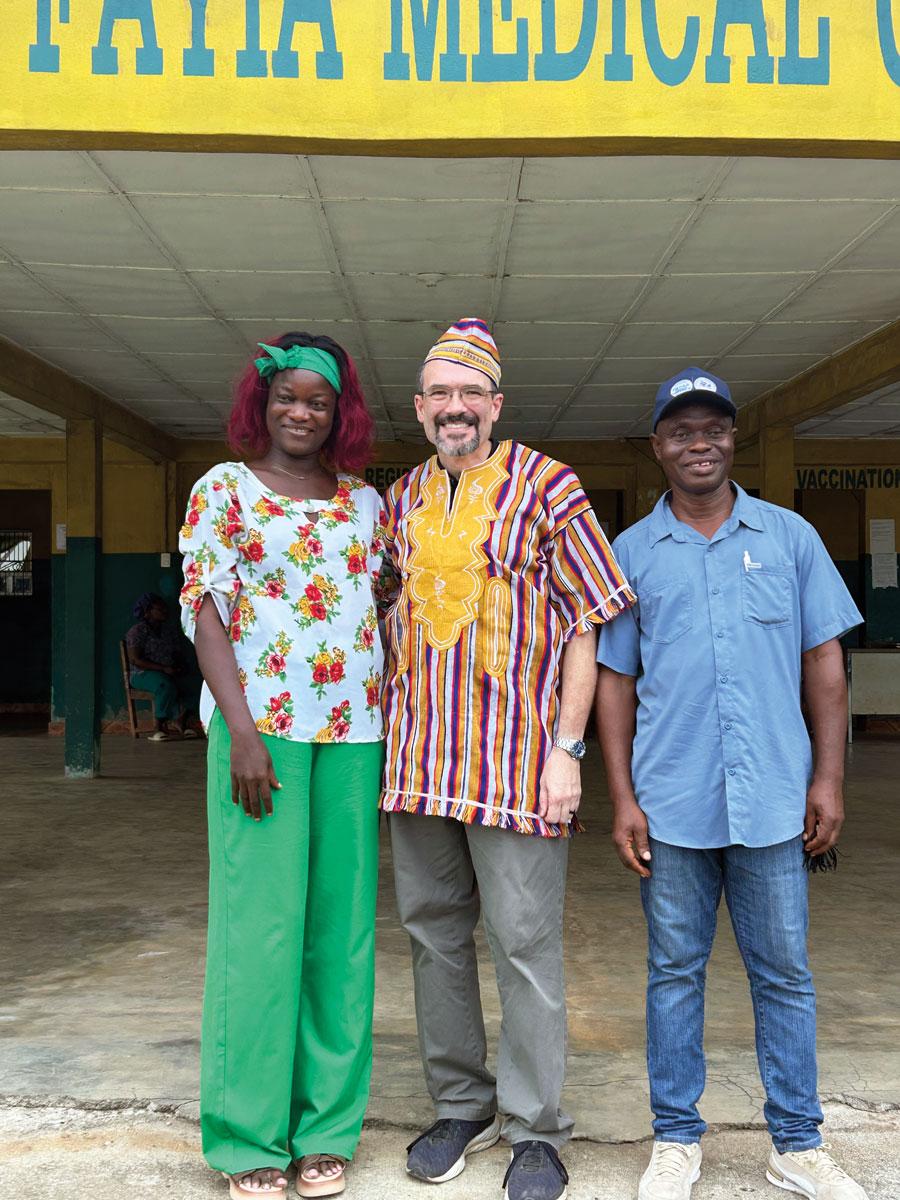 John Zentz poses with the medical professionals who worked with him to learn how to use ultrasound equipment in Liberia