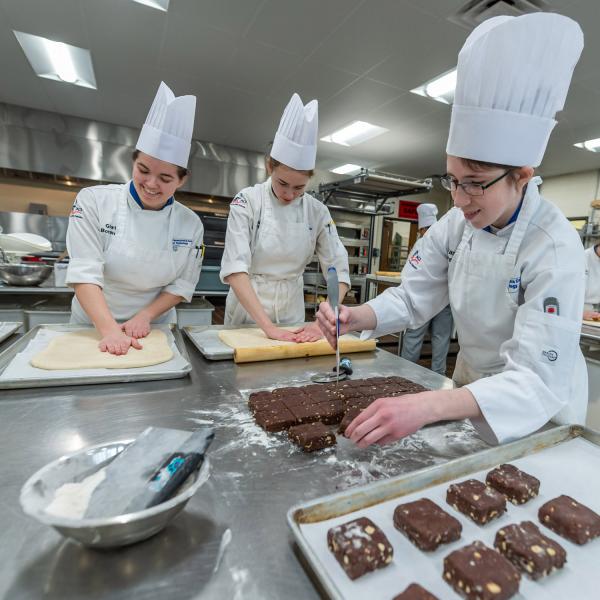 Penn College Baking & Pastry students train in a professional kitchen lab.