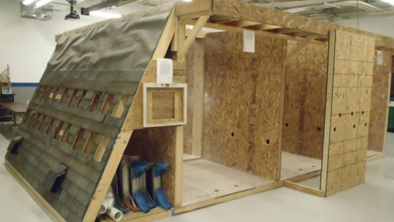 The Retrofit Installer and Crew Leader training mock-up demonstrates and assesses competency for dense-pack insulation, band joist air sealing, drywall installation and repair, caulking, attic ventilation, and attic access.