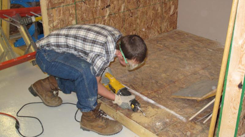 In the Weatherization Tactics lab, students are able to remove the floors of the mock-up in order to see how well they performed a dense pack insulation.