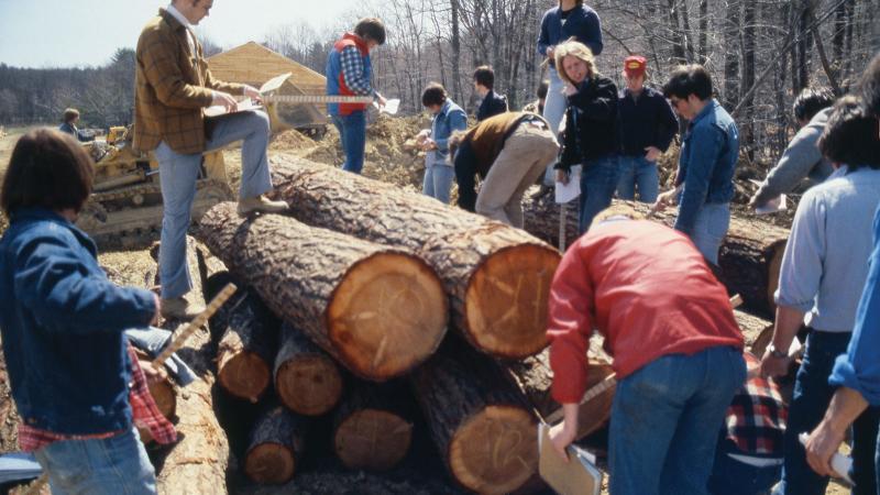circa 1983: Calculation of the amount of production lumber per log with instructor Glenn Spoerke, on logs.