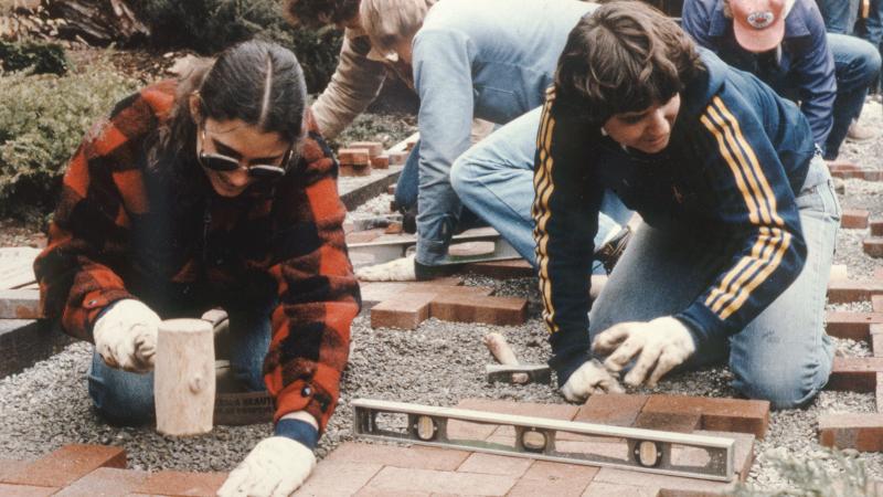 1985: Students in the nursery management major retrofit brick pavers into the Earth Science Center patio garden, installed by the first graduating class in 1973.