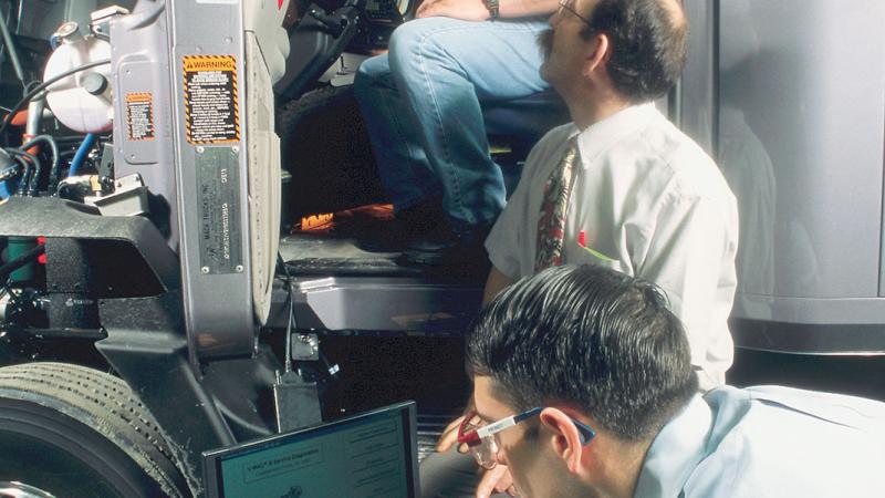 2004: Instructor Scott Welch, center, with students in diesel technology: Mack emphasis.