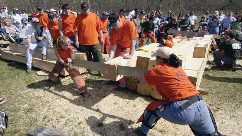 2004: Penn College's Jennifer L. Vastine, right,  and Abbalie L. Hutton, left,  compete in the crosscut saw competition at the Mid-Atlantic Woodsmen’s Meet, held at the Earth Science Center. The college took second, earning nine first-place medals.