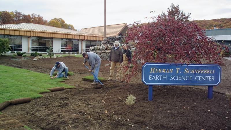 2007: Landscaping students, under the instruction of Dennis Skinner, second from right, lay sod to replace the turf at the Earth Science Center.