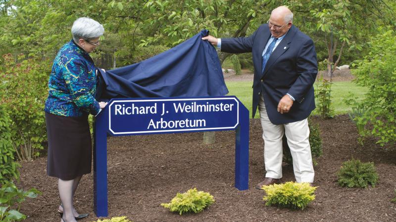2008: President Davie Jane Gilmour and Weilminster unveil the sign denoting dedication of the 5-acre arboretum.