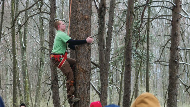 2016: Student Anthony A. Hampton takes part in the Pole Climb event during Timber Fest at the Earth Science Center.