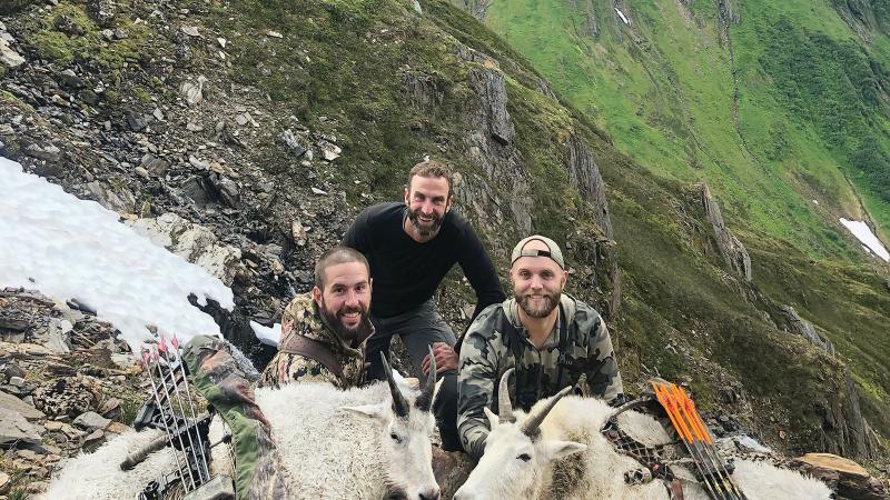 Brian S. Watkins, ’10, left, with fellow Penn College grad Dave Moore, ’10, center, joins hunting partner Trevor Embry on a mountain goat hunt in rugged Southeast Alaska. The story of their mountain adventure is one of many Watkins has authored for Alaska Sporting Journal.
