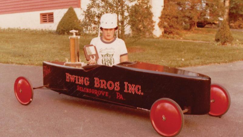  Ewing proudly displays some of his Soap Box Derby trophies outside his Selinsgrove home in 1977. He credits building Soap Box Derby and remote-control cars for developing his mechanical aptitude and learning the value of patience.