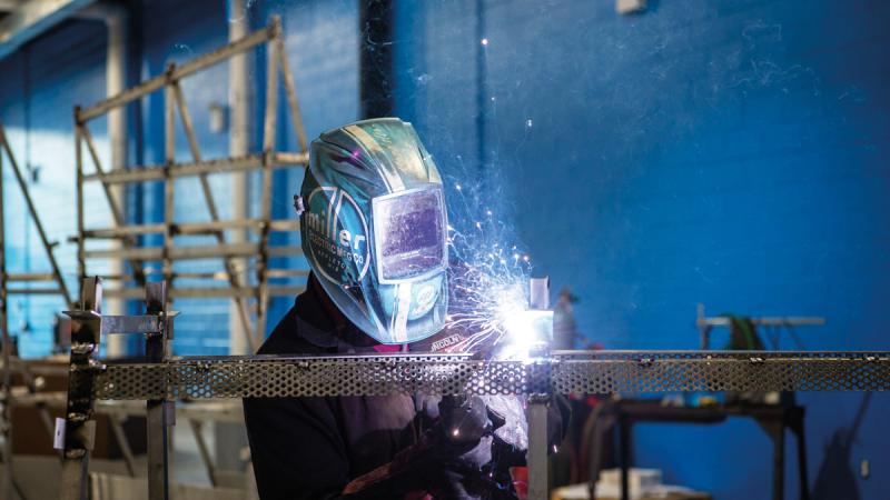James N. Colton II, assistant professor of welding, who led the Penn College fabrication team, applies one of thousands of welds to the structure.