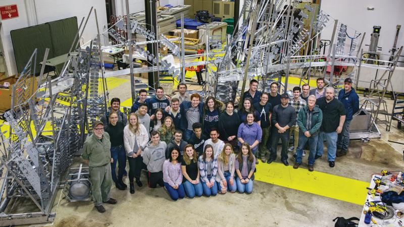 Members of the Penn College and Penn State teams pose with the completed chapel in Penn State’s Laundry Building prior to its shipment to Rome in February. Photo courtesy of Penn State