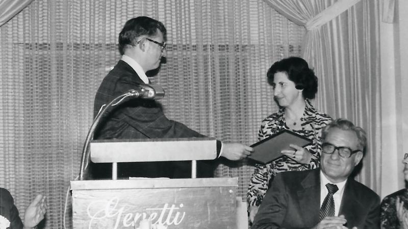  During the college’s spring recognition banquet in 1977, Dave Heiney, assistant dean of student and career development, presents Muzic an award for her dedication to the developmental program (today known as the Academic Success Center).