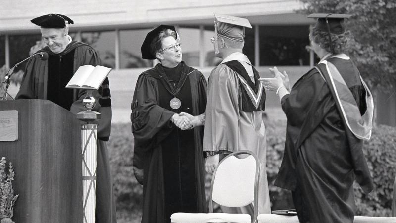 Gilmour is officially installed as president during a 1998 convocation ceremony. From left: Robert Dunham, then-Board of Directors chairman; Gilmour; Student Government Association President Kenneth R. Harding Jr.; and Veronica M. Muzic, who would later retire as vice president for academic affairs/provost. 