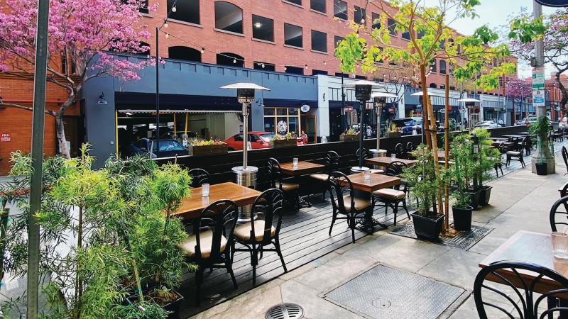 Outdoor dining – enhanced when the city added concrete barriers to block on-street parking – became the restaurant’s “saving grace” for the better part of a year. But it was tiring: Staff moved heavy mahogany tables on iron bistro stands in and out each day and made a longer trek from kitchen to table.