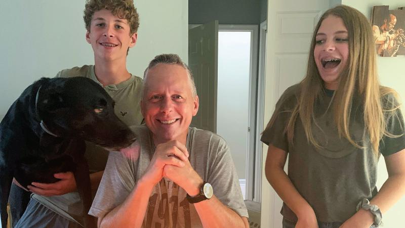 Reed celebrates his 50th with children Gavin and Cali, and their black lab, Rio.