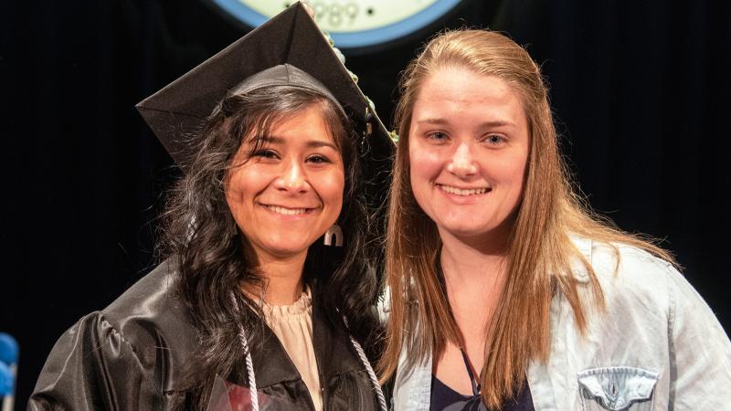 Beaver, right, attends Ybarra’s commencement ceremony, where she honored the student speaker with a bouquet. 