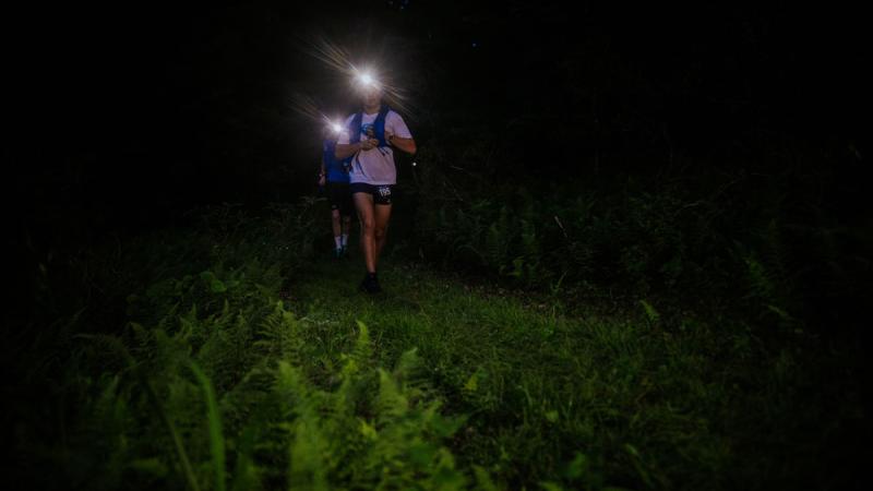 McCoy's headlamp shines as he runs through the dark. [Photo courtesy of Emily Shaffer]