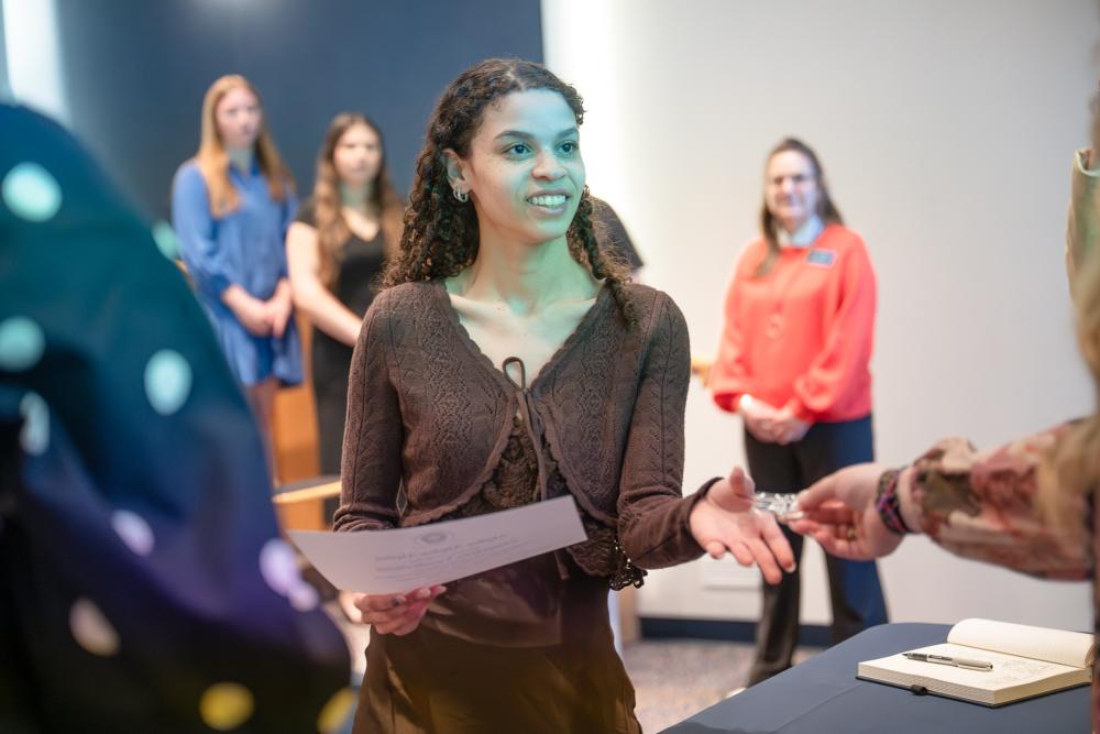 Student at first-generation induction ceremony.