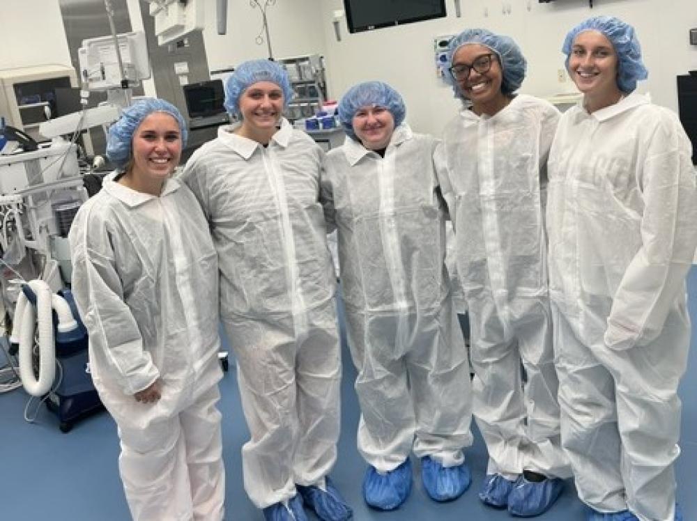 group of students wearing medical scrubs