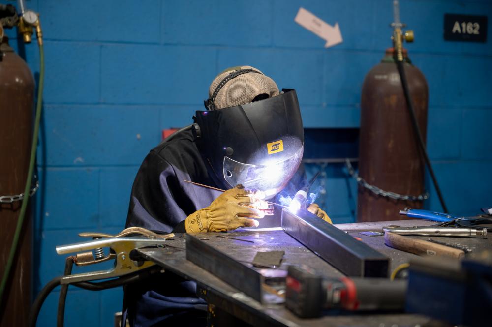 pct student welding in a welding lab